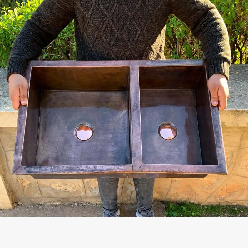 Cooper handmade double vessel kitchen sink showcasing beautiful copper craftsmanship.