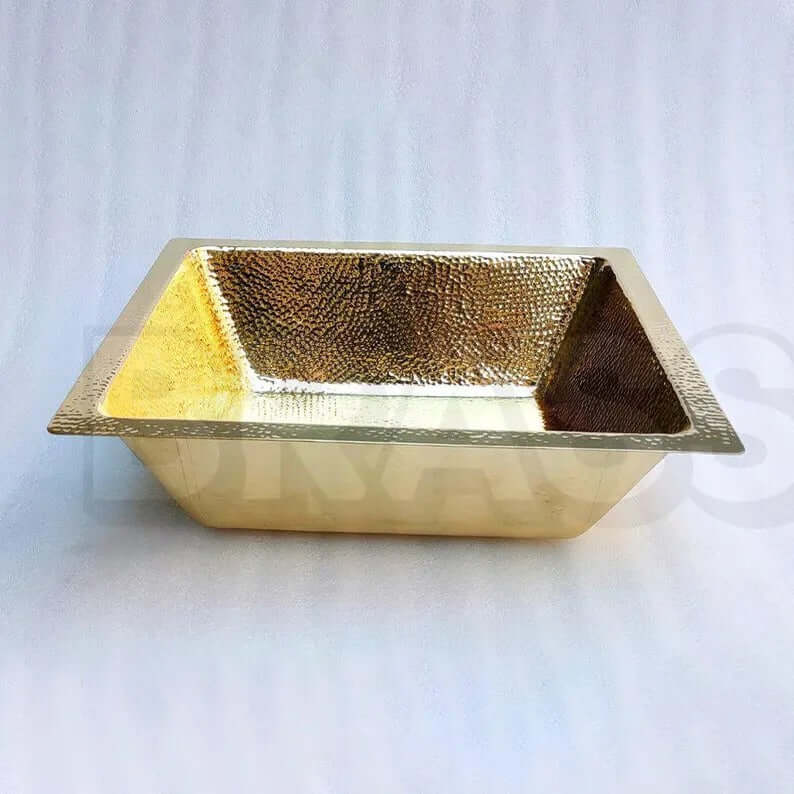 Handcrafted brass bar sink with hammered finish, perfect for kitchen or wet bar elegance.