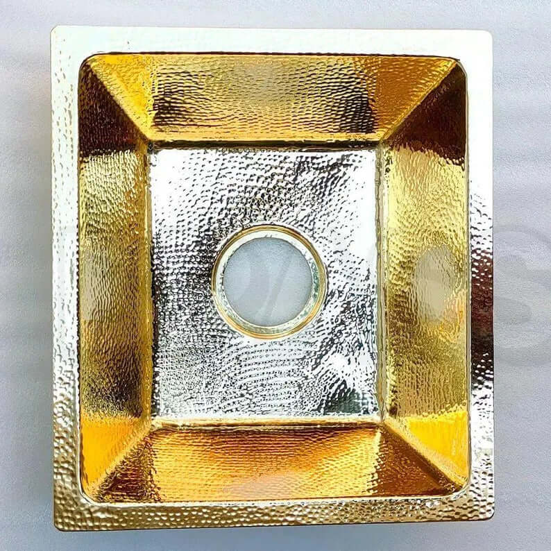 Handcrafted brass bar sink with hammered finish, ideal for kitchen or wet bar, showcasing artisanal elegance.