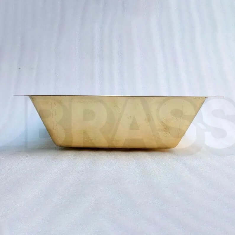 Elegant handcrafted brass bar sink showcasing a unique hammered design, ideal for kitchens or wet bars.