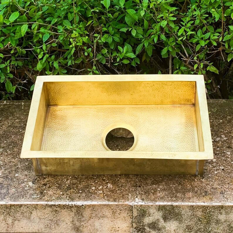 Handmade golden brass sink, 30 x 14 x 8 inches, showcasing artisanal craftsmanship for bathroom decor.