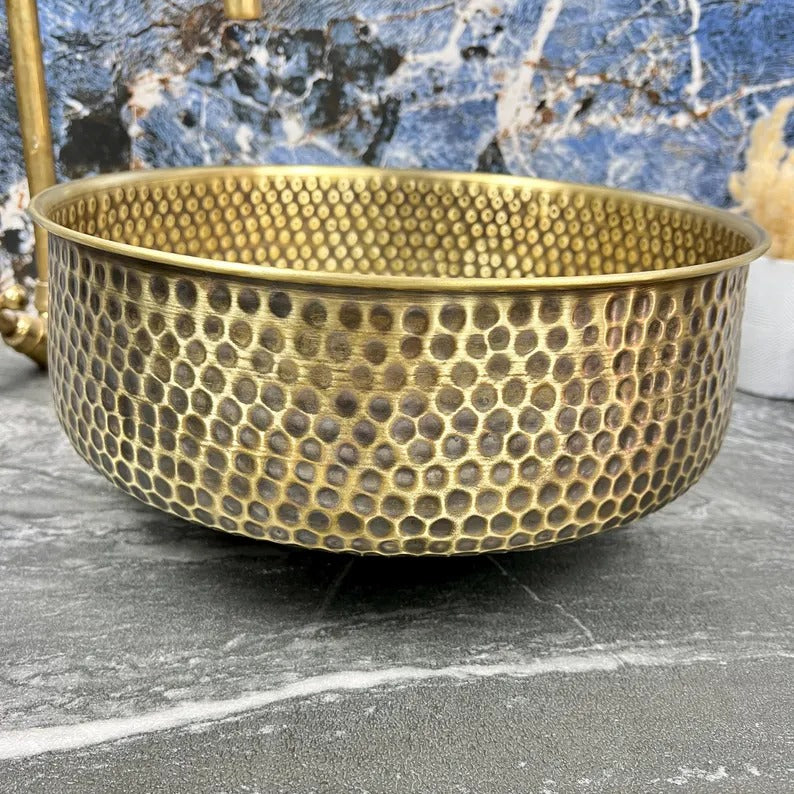 Hand-Hammered Brass Round Sink with intricate texture and polished rim, perfect for a farmhouse vanity.