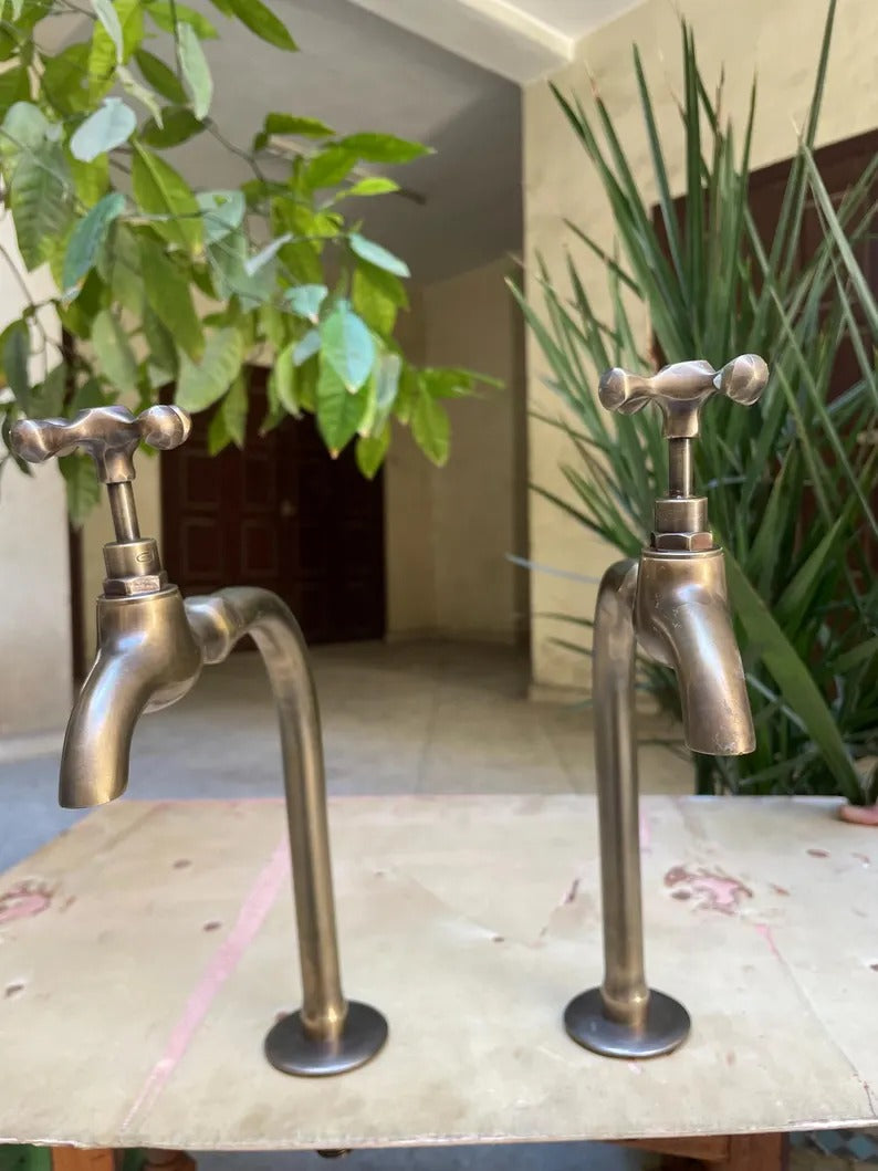 Premium handmade unlacquered brass dispensers featuring a vintage design with two handles and an elegant finish.