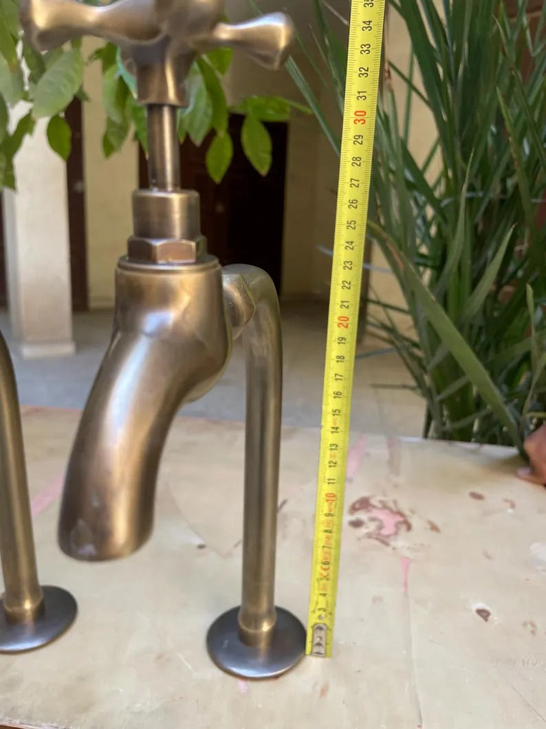 Premium unlacquered brass water dispenser faucet shown with measuring tape for size comparison.