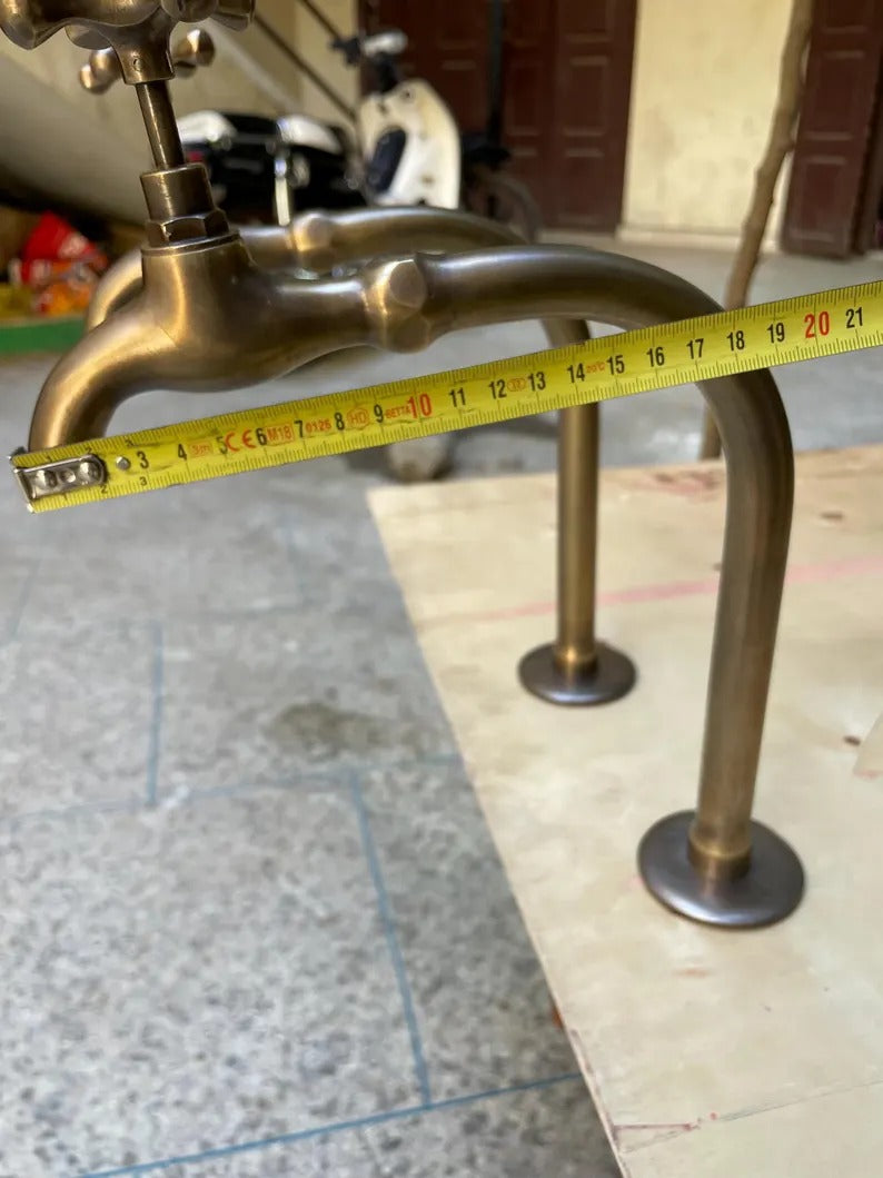 Premium unlacquered brass water dispenser faucet with measuring tape, showcasing its craftsmanship and height.