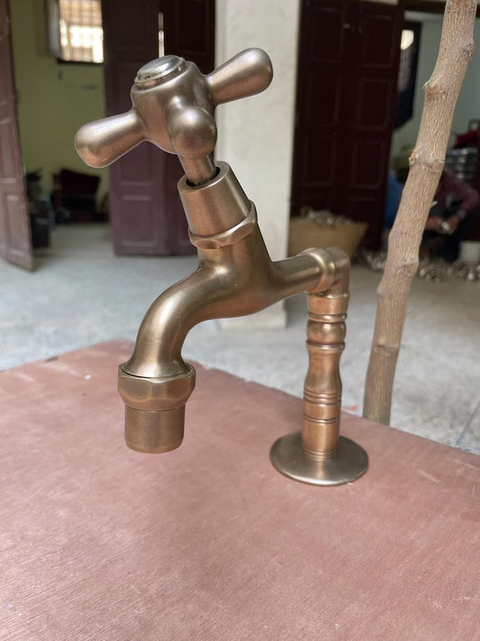 Brass water filter faucet with single handle, handcrafted design showcasing elegant patina finish.