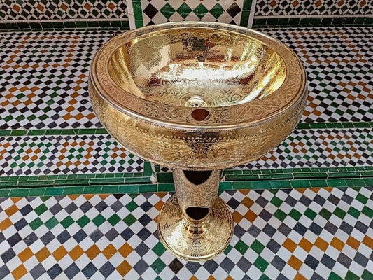Elegant copper basin on a decorative tiled floor, showcasing intricate designs and high-quality craftsmanship.