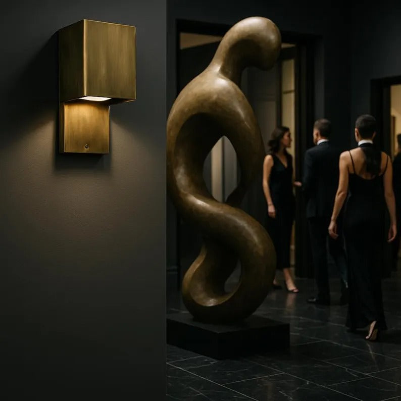 Handcrafted copper wall sconce illuminating modern space with geometric design and elegant ambiance.