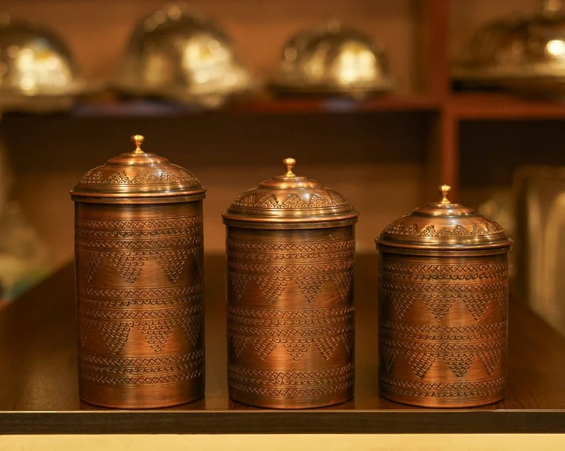 Set of 3 handmade copper spice containers with intricate designs, perfect for modern kitchen decor.